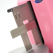 Machine à décorer les gâteaux Maxima, diamètre 36,4 cm, en rose, avec accessoires pour la décoration de pâtisseries.