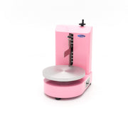 Machine à décorer les gâteaux Maxima, diamètre 36,4 cm, en rose, avec accessoires pour la décoration de gâteaux.