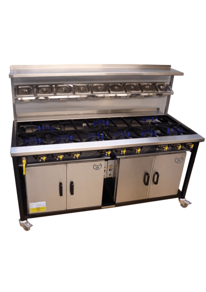 Cuisinière indienne professionnelle SHAAN à gaz avec 5 brûleurs, surface en acier inoxydable et option supplémentaire visible.